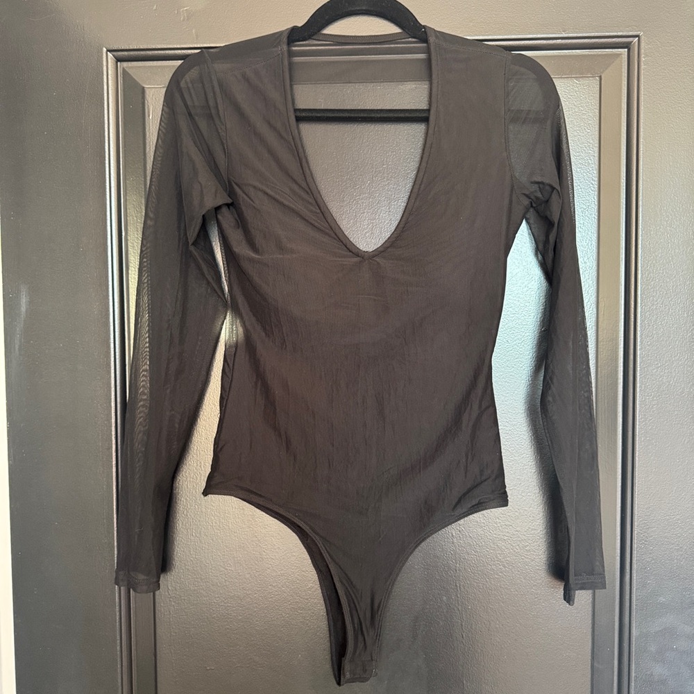 Klassy Network. Mesh black bodysuit with built in bra.